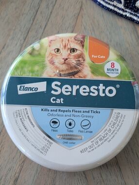 Elanco Seresto Cat Flea Collar Tin — Blue, White, Green, Orange